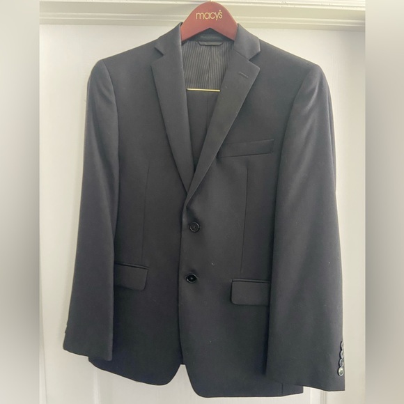 Calvin Klein Black Suit with Notched Lapel. Jacket 36S pants 30W30L. Worn once.